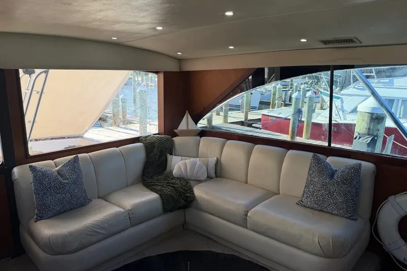 Slide: The Image of Luxurious interior of 1997 Ocean Yachts 40 Super Sport with plush seating and marina view. - 47