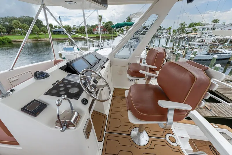 Slide: The Image of Cockpit of 1997 Ocean Yachts 40 Super Sport with leather seats and navigation controls. - 32