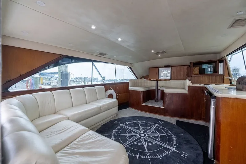 Slide: The Image of Luxurious interior of a 1997 Ocean Yachts 40 Super Sport with plush seating and nautical decor. - 52