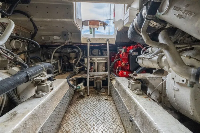 Slide: The Image of Engine room of a 1997 Ocean Yachts 40 Super Sport, showcasing mechanical components. - 71