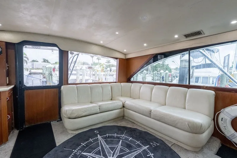 Slide: The Image of Luxurious interior of 1997 Ocean Yachts 40 Super Sport with white leather seating. - 50