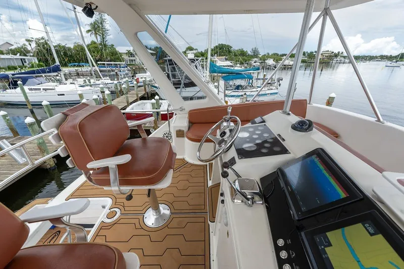 Slide: The Image of 1997 Ocean Yachts 40 Super Sport yacht helm with leather seats and navigation equipment. - 30