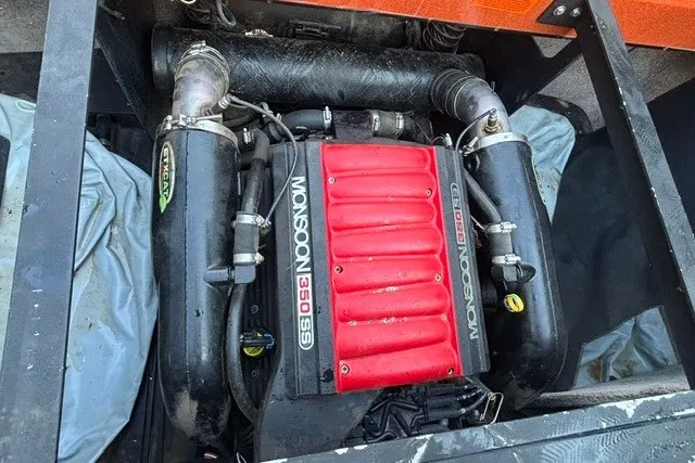 Slide: The Image of 2013 Malibu Wakesetter 23 LSV Monsoon 350 engine, red and black components, detailed view. - 10