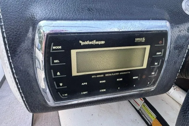 Slide: The Image of Rockford Fosgate media player in 2013 Malibu Wakesetter 23 LSV boat dashboard. - 14