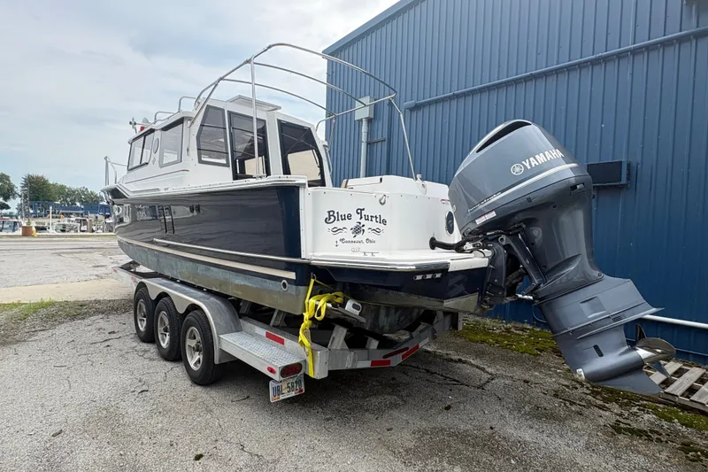 Slide: The Image of 2018 Ranger Tugs R-27 boat on trailer with Yamaha outboard motor. - 8