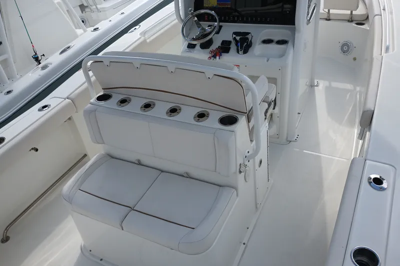 Slide: The Image of 2021 Sea Hunt Gamefish 27FS boat interior with seating and control console. - 21