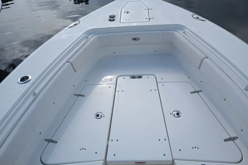 Slide: The Image of 2021 Sea Hunt Gamefish 27FS boat deck with storage compartments and seating. - 14