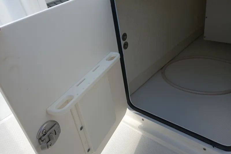 Slide: The Image of Open storage compartment on 2021 Sea Hunt Gamefish 27FS boat. - 31