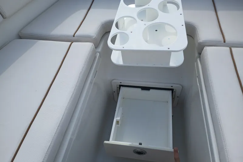 Slide: The Image of Interior of 2021 Sea Hunt Gamefish 27FS with seating and storage compartments. - 15