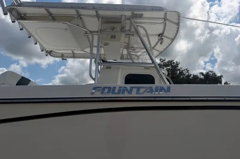 Slide: The Image of 2006 Fountain 32 Center Console boat under a cloudy sky. - 7