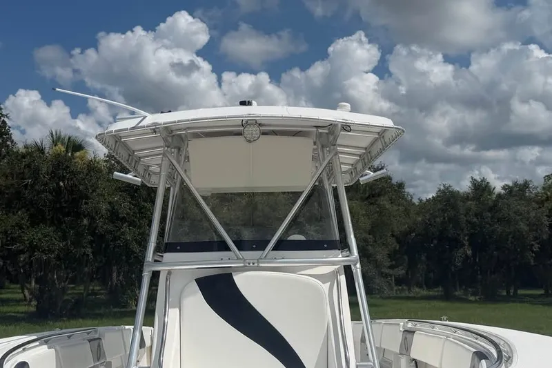 Slide: The Image of 2006 Fountain 32 Center Console boat under cloudy sky, front view. - 9