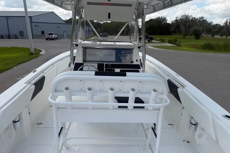 Slide: The Image of 2006 Fountain 32 Center Console boat with rod holders and Garmin navigation system. - 11