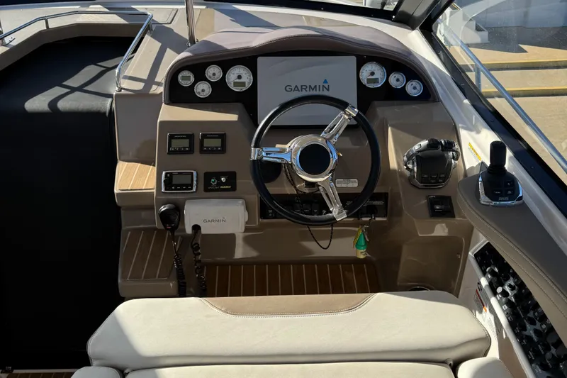 Slide: The Image of Cockpit of 2016 Regal 35 Sport Coupe with Garmin navigation system and modern controls. - 33