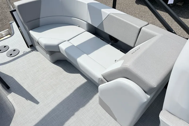 Slide: The Image of 2026 Manitou Encore boat interior with sleek, modern gray seating design. - 15
