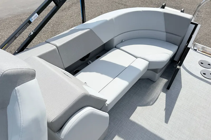 Slide: The Image of 2026 Manitou Encore boat interior with sleek, modern seating design. - 14
