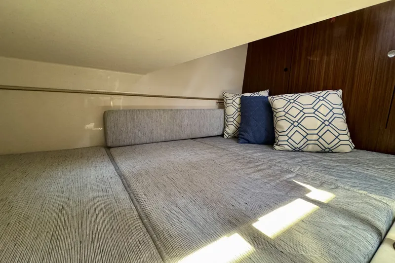 Slide: The Image of Cozy cabin interior of 2017 Pursuit OS 325 Offshore with stylish cushions. - 27