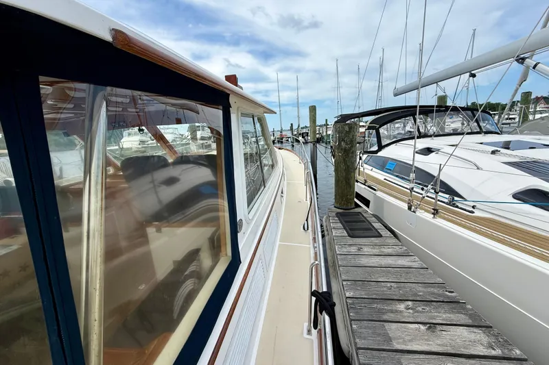 Slide: The Image of 2001 Grand Banks 49 Eastbay HX yacht docked at marina, showcasing sleek design and craftsmanship. - 18