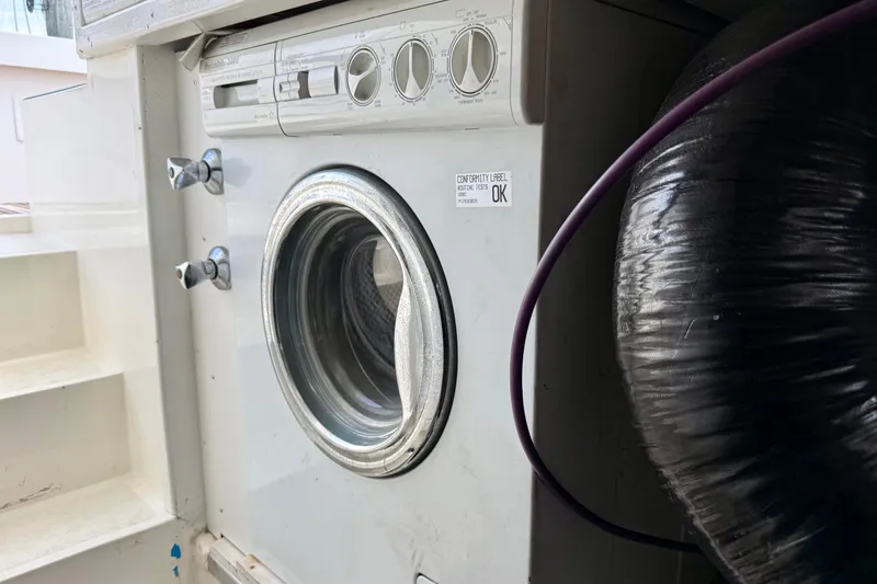 Slide: The Image of Washing machine installed on a 2001 Grand Banks 49 Eastbay HX yacht. - 32