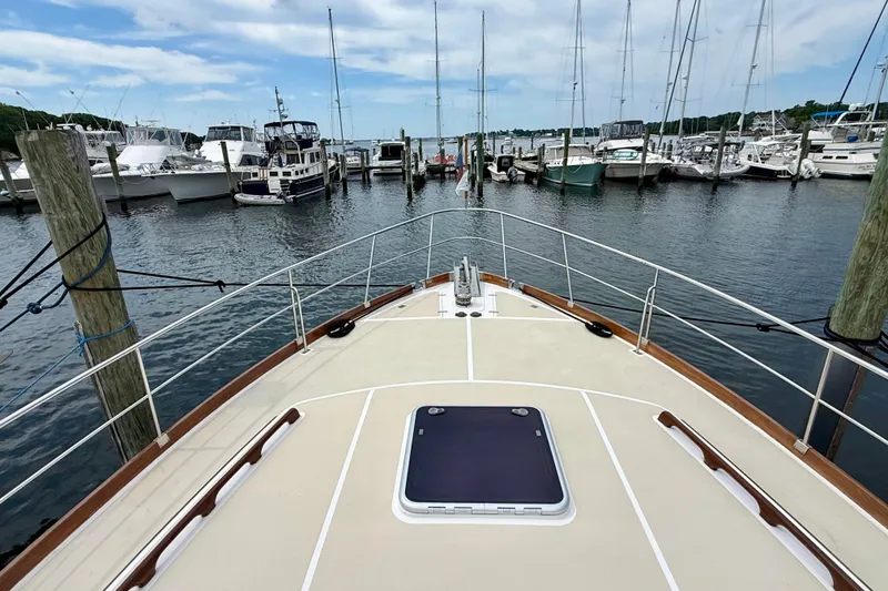 Slide: The Image of Bow view of 2001 Grand Banks 49 Eastbay HX yacht docked in a marina. - 27