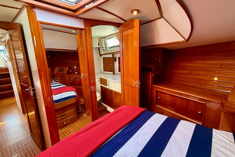 Slide: The Image of Luxurious 2001 Grand Banks 49 Eastbay HX yacht interior with wood finish and cozy cabins. - 38