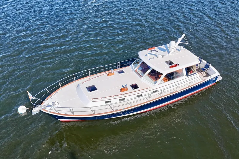 Slide: The Image of 2001 Grand Banks 49 Eastbay HX yacht cruising on open water. - 11