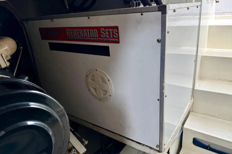 Slide: The Image of Engine room of 2001 Grand Banks 49 Eastbay HX with generator set. - 31