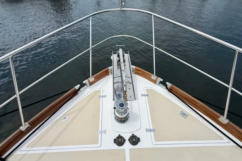 Slide: The Image of Bow view of 2001 Grand Banks 49 Eastbay HX yacht with anchor and railing. - 28