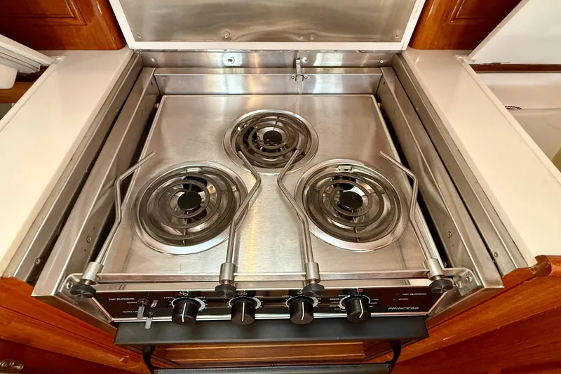 Slide: The Image of Stainless steel stove with three burners on a 2001 Grand Banks 49 Eastbay HX yacht. - 55