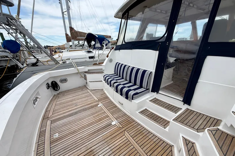 Slide: The Image of 2001 Grand Banks 49 Eastbay HX yacht with teak deck and striped seating. - 17