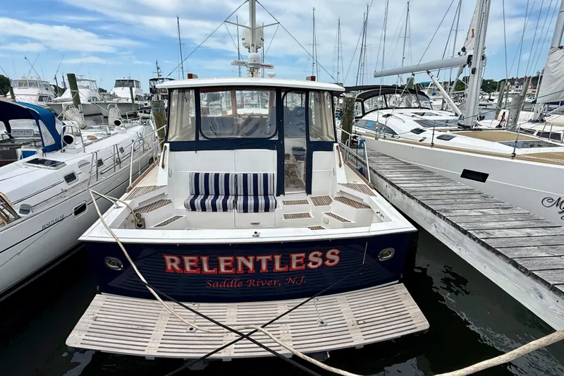 Slide: The Image of 2001 Grand Banks 49 Eastbay HX yacht "Relentless" docked at a marina, Saddle River, NJ. - 12