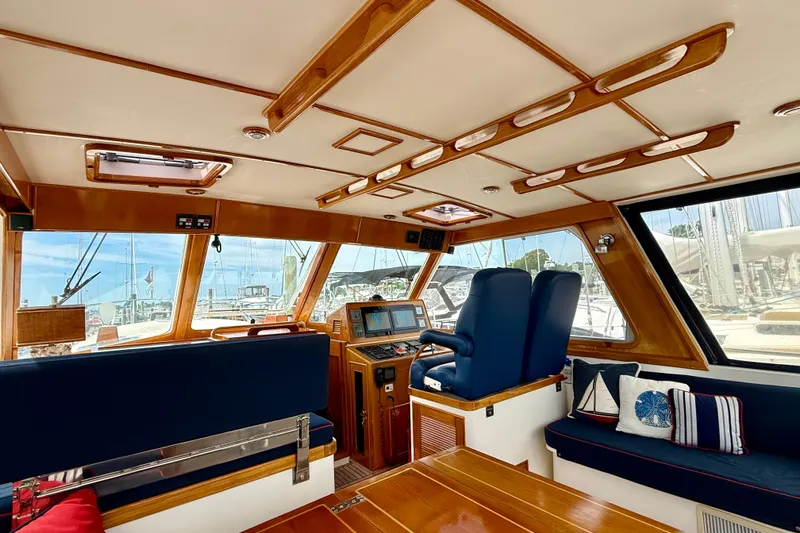 Slide: The Image of Luxurious interior of 2001 Grand Banks 49 Eastbay HX yacht with plush seating and navigation equipment. - 71