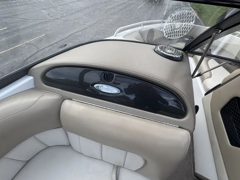 Slide: The Image of The image shows the cockpit of a 2007 Malibu Wakesetter 23 LSV with beige upholstery. - 12