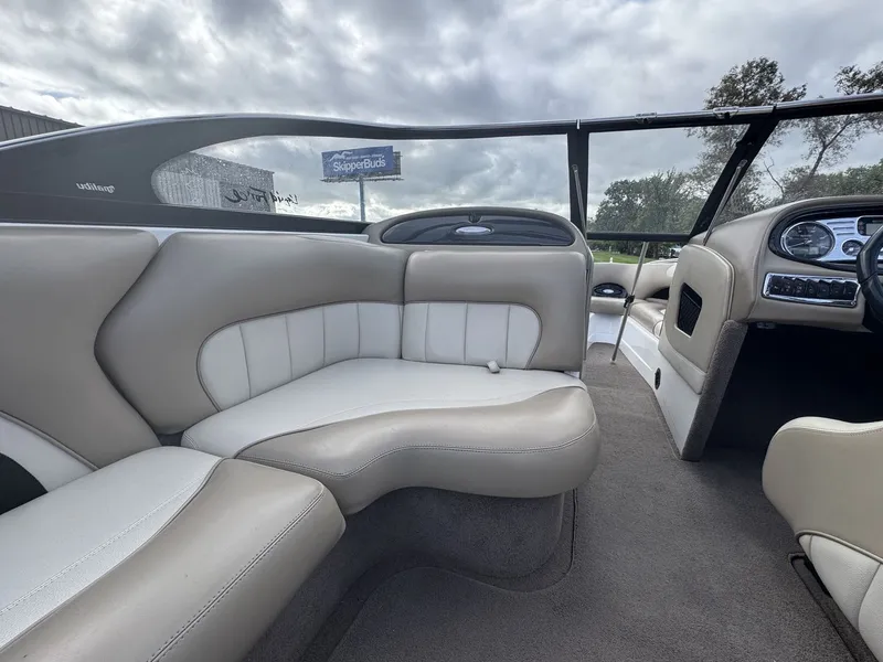 Slide: The Image of The image shows the interior of a 2007 Malibu Wakesetter 23 LSV with beige and white seating. - 11