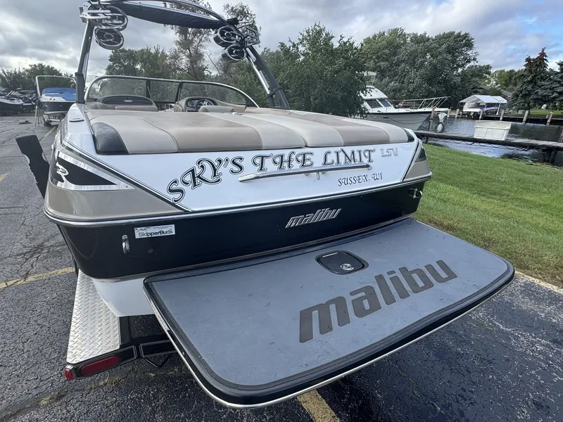 Slide: The Image of The image shows the rear of a 2007 Malibu Wakesetter 23 LSV with a large swim platform. - 2