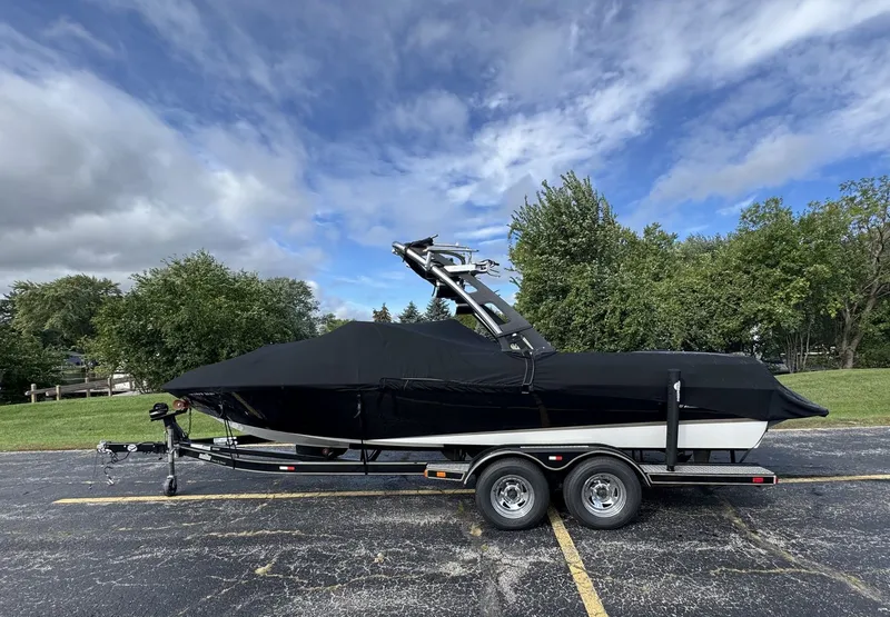 Slide: The Image of A 2007 Malibu Wakesetter 23 LSV on a trailer, covered with a black tarp. - 30