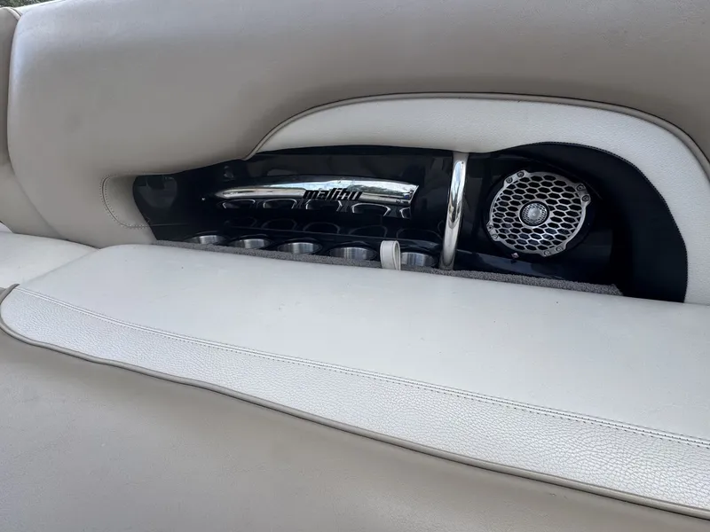 Slide: The Image of Close-up of a speaker and cup holders in a 2007 Malibu Wakesetter 23 LSV. - 10