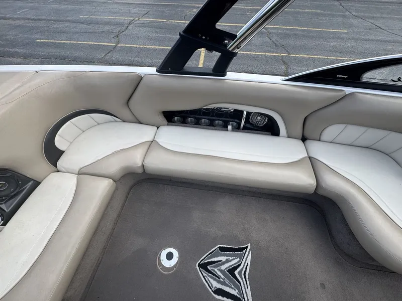 Slide: The Image of Interior of a 2007 Malibu Wakesetter 23 LSV with gray upholstery and carpeted floor. - 9
