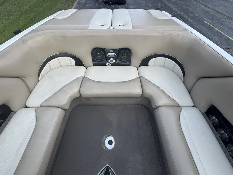 Slide: The Image of The image shows the interior of a 2007 Malibu Wakesetter 23 LSV with beige seating. - 7