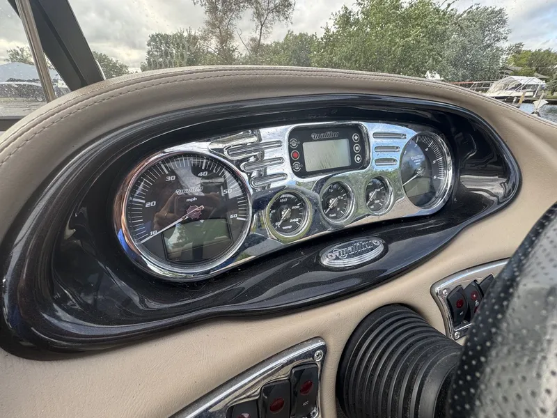 Slide: The Image of Dashboard of a 2007 Malibu Wakesetter 23 LSV with speedometer and controls. - 18