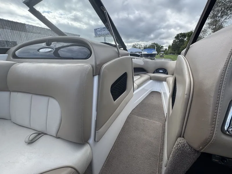 Slide: The Image of The image shows the interior of a 2007 Malibu Wakesetter 23 LSV with beige seating. - 22