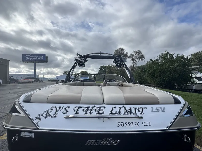 Slide: The Image of A 2007 Malibu Wakesetter 23 LSV with "Sky's the Limit" written on the stern. - 3