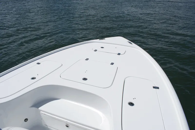 Slide: The Image of 2024 Sea Hunt BX22BR boat deck on calm water. - 6