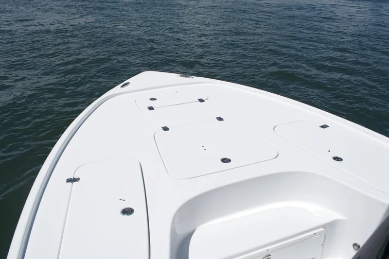 Slide: The Image of 2024 Sea Hunt BX22BR boat deck on calm water. - 5