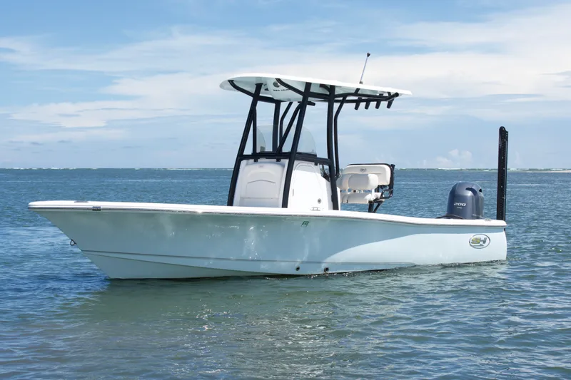 Slide: The Image of 2024 Sea Hunt BX22BR boat on calm ocean waters under a clear sky. - 3