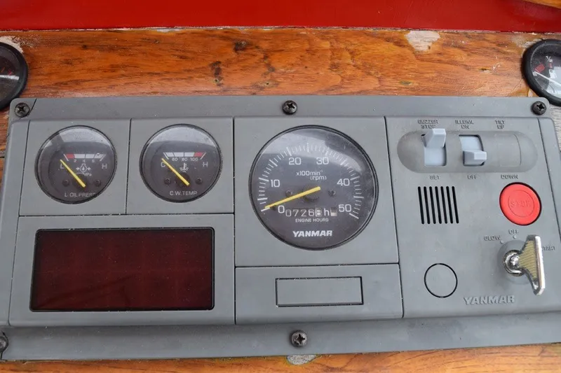 Slide: The Image of Instrument panel of a 1974 Wasque 32 boat with Yanmar engine gauges. - 18