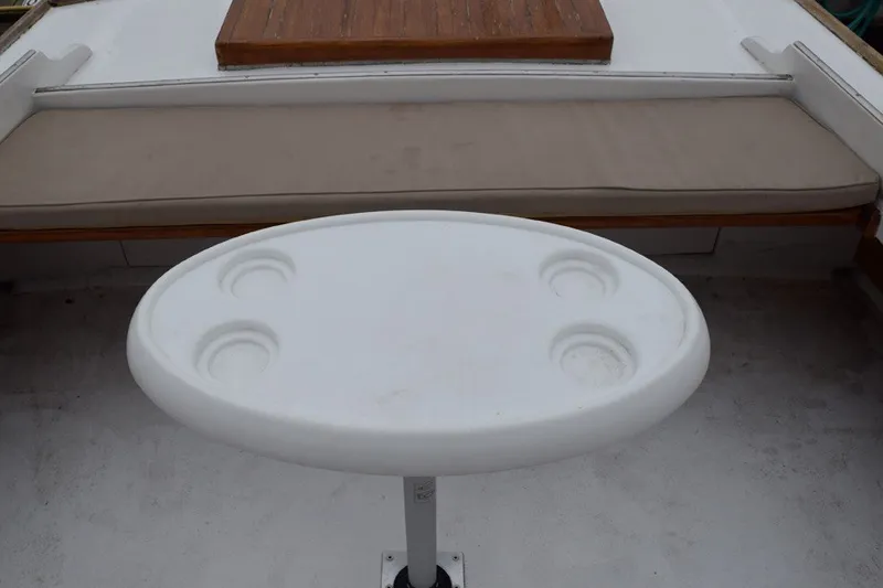 Slide: The Image of Oval table with cup holders on a 1974 Wasque 32 boat deck. - 15