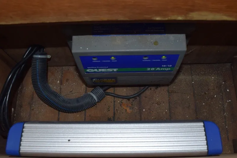 Slide: The Image of Battery charger in a 1974 Wasque 32 boat, showing wiring and installation. - 37