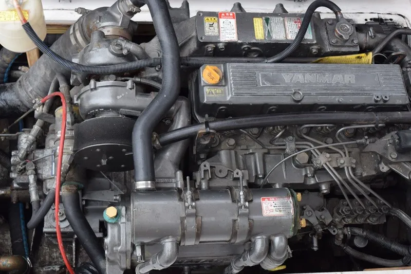 Slide: The Image of Engine of a 1974 Wasque 32 boat, featuring a Yanmar diesel engine. - 39