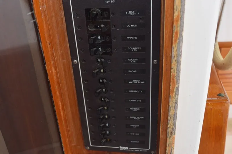 Slide: The Image of 1974 Wasque 32 electrical panel with labeled switches and controls. - 32
