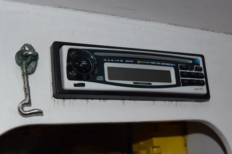 Slide: The Image of Marine stereo system on a 1974 Wasque 32 boat interior. - 34